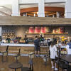 Image of people waiting outside Starbucks in the atrium. 