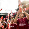 Temple students cheering on the football team at the Homecoming game
