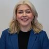 Professional headshot of a smiling person.
